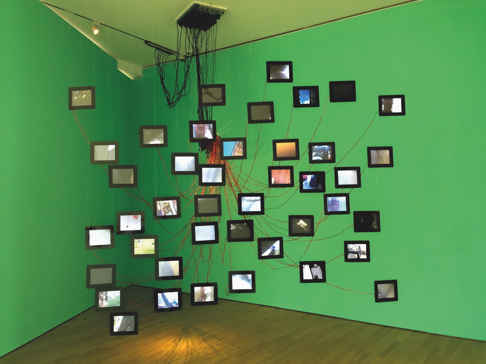 Humantracks, MAK exhibition view with a green background